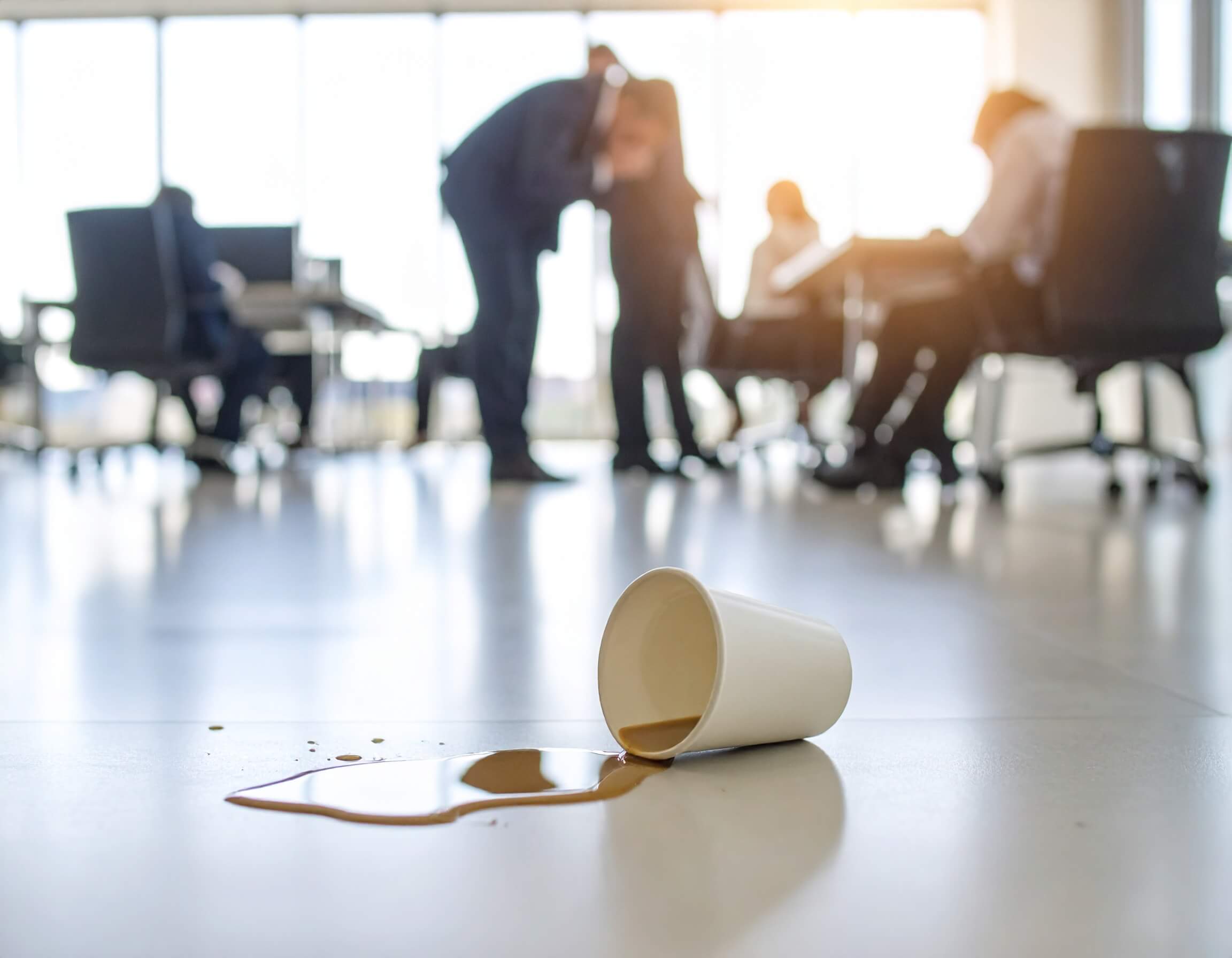 Spilled coffee, with an employee coughing in the background.