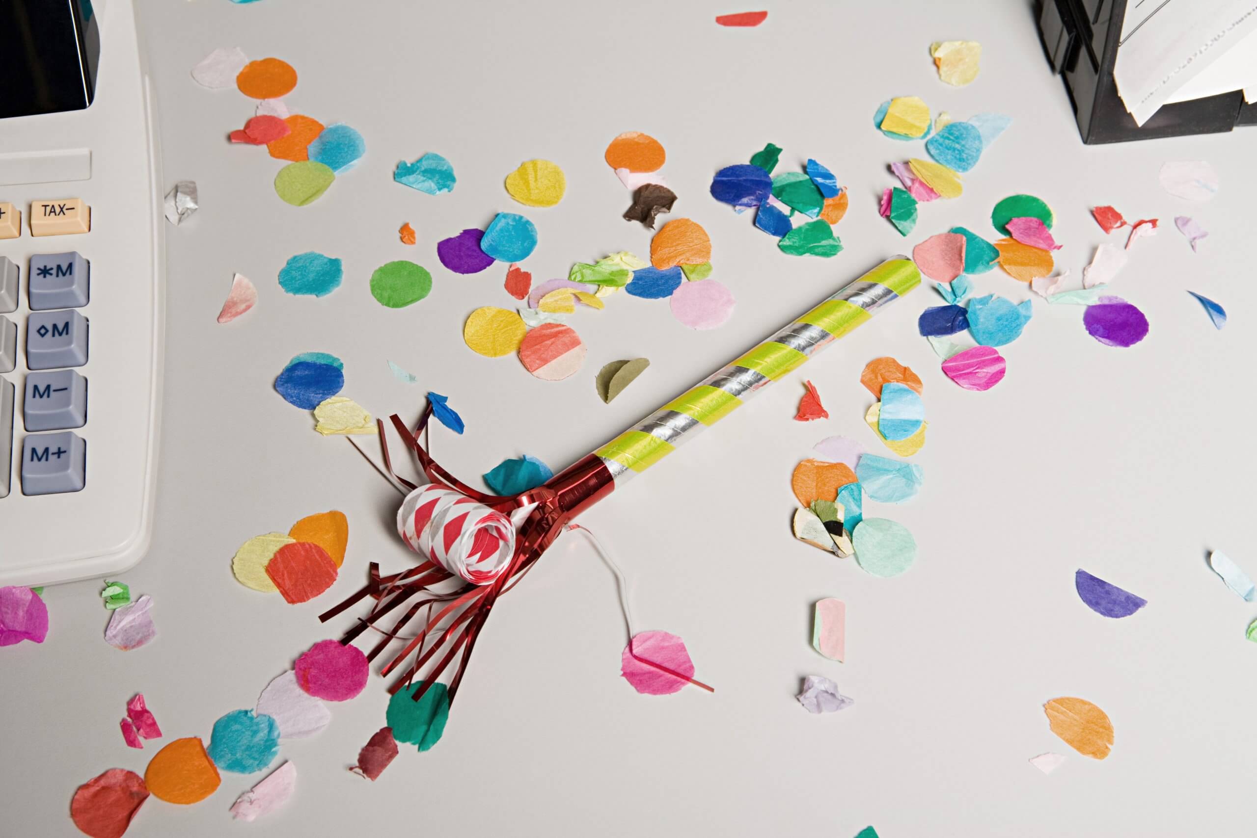 Party horn on office desk